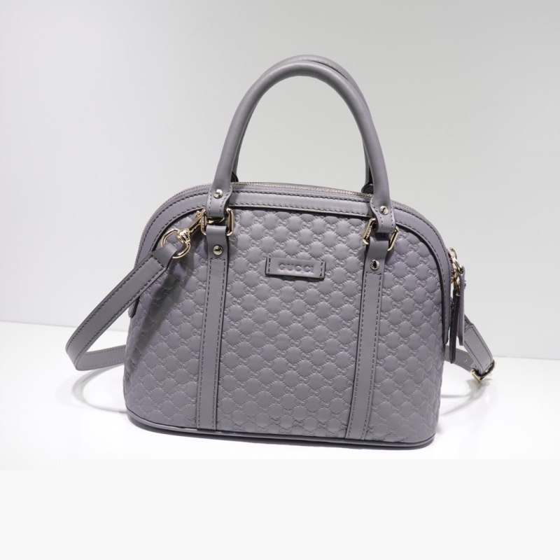 G*u*i top handle bags